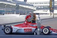 Marcus Ericsson poses for a photo with his girlfriend Iris Tritsaris Jondahl on May 30, 2022, after winning the Indianapolis 500 at the Indianapolis Motor Speedway - Source: Getty